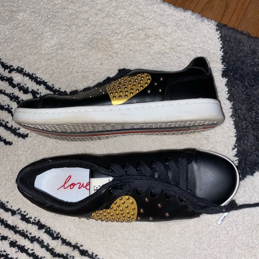 Black and gold sneakers